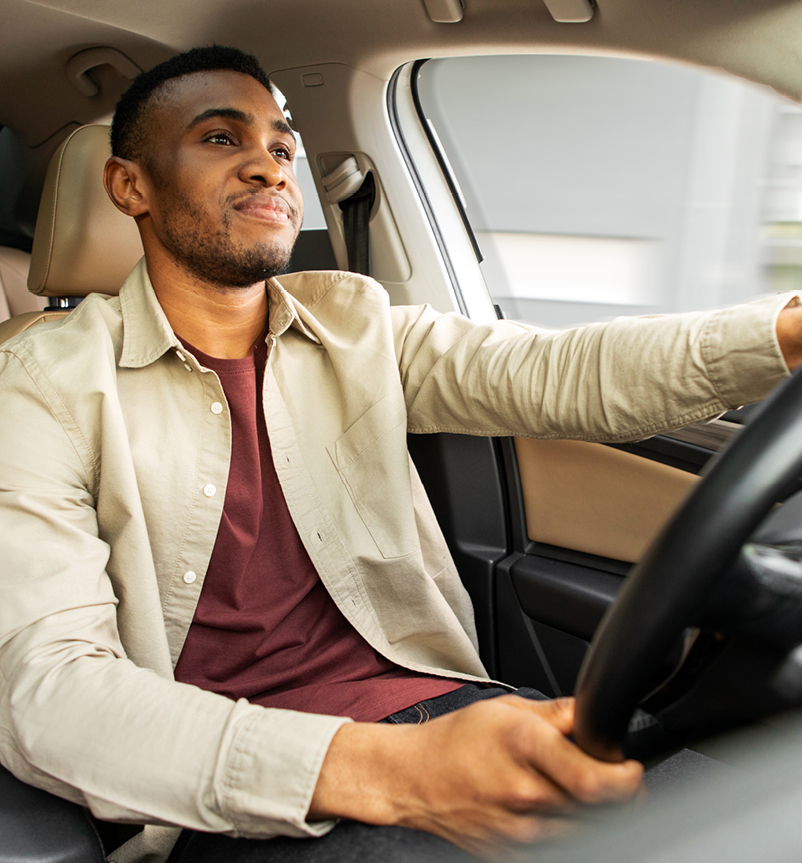 Happy man driving car