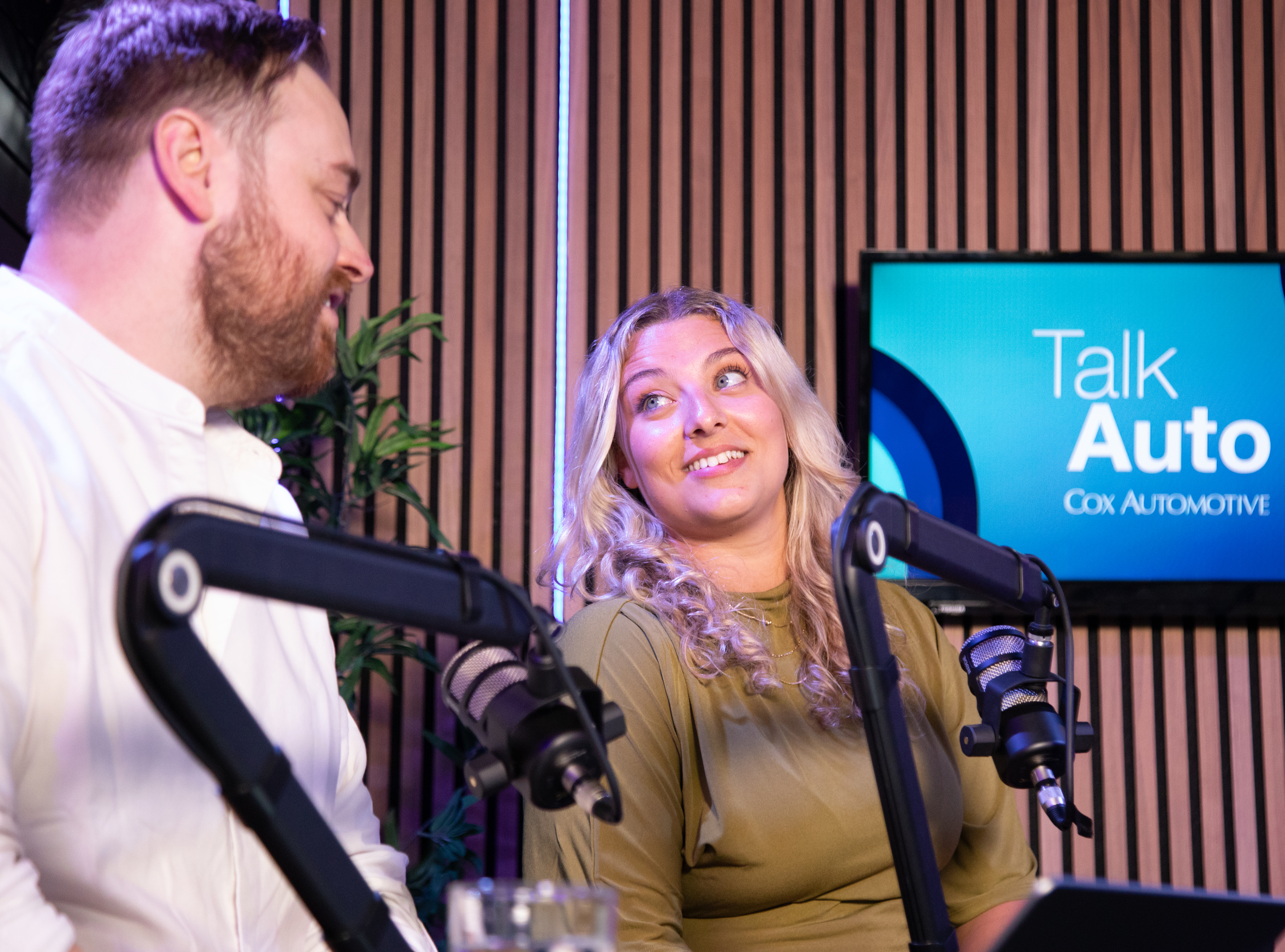 Talk Auto hosts, Ben and Holly in mid conversation