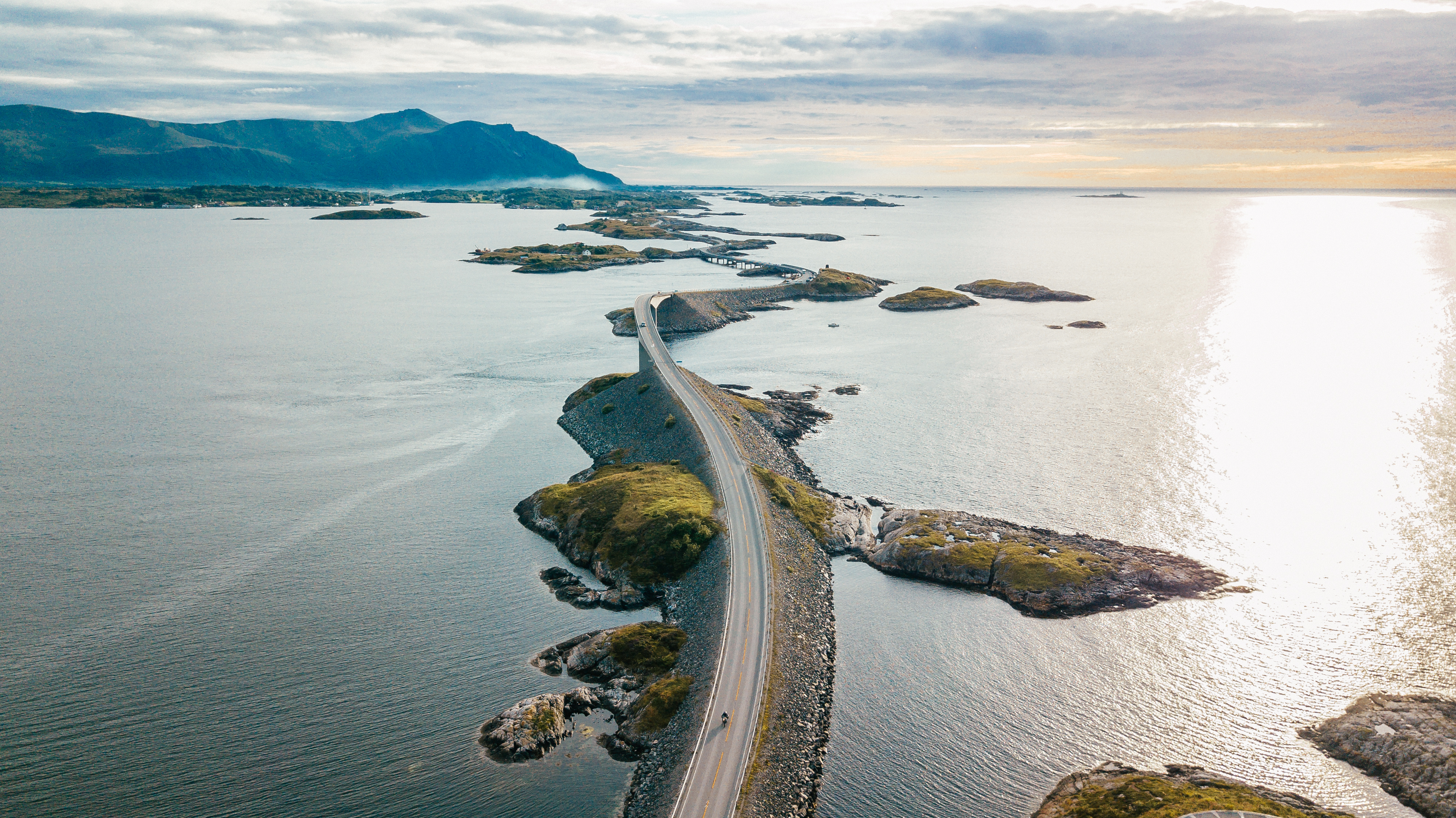 Aerial shot of road surrounded by water