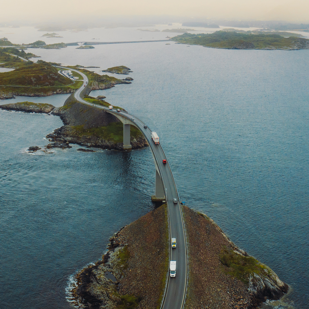 Aerial scenic road surround by water